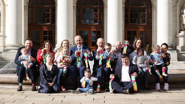 Taoiseach Micheal Martin TD and Will Cronin, CEO DSI, pictured at Government Buildings, Dublin with children and parents for the launch of the Down Syndrome Ireland’s Lots of Socks campaign