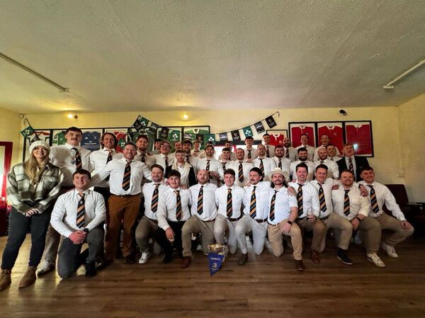 The Newbridge RFC squad celebrate back in their clubhouse