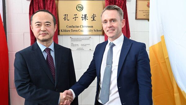 Principal of Kildare Town Community School Mr.John P Hayes with the Chinese Ambassador H.E. ZHAO Xiyuan for the unveiling of the Confucius Classroom plaque Principal of Kildare Town Community School Mr.John P Hayes with the Chinese Ambassador H.E. ZHAO Xiyuan for the unveiling of the Confucius Classroom plaque