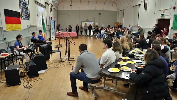 Listening to Grace O'Donnell on keyboard at the final evening pizza and culture event