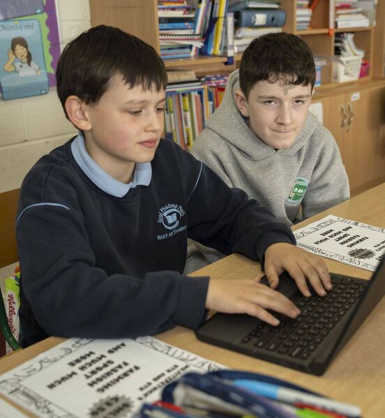 Joseph and Padraig working hard on the newspaper
