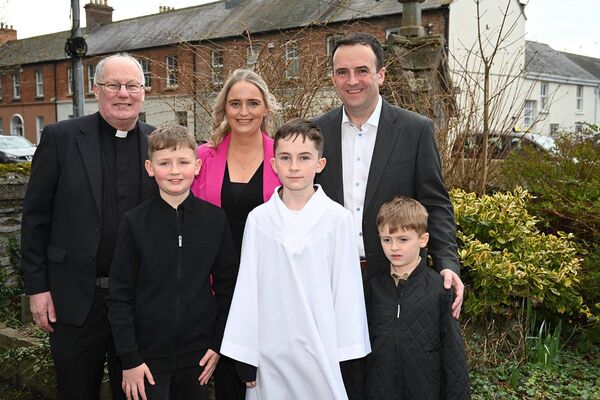 Daire McDermott with his family and parish priest Fr Liam Merrigan