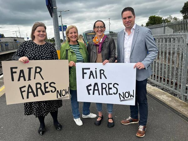 Minister Heydon pictured with Cllr Peggy O’Dwyer and representatives of the local fairer fares action group who campaigned long hard for the fairer fares