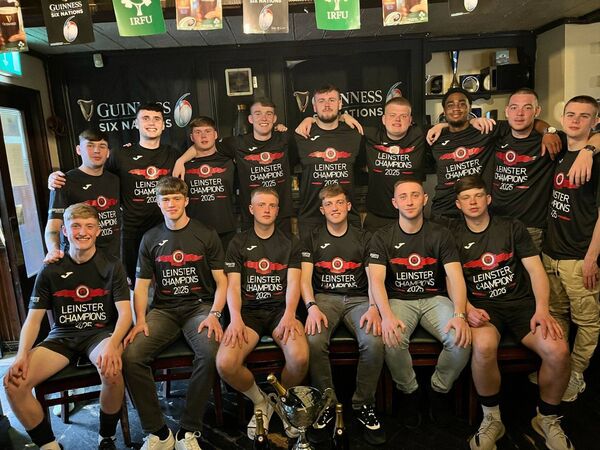 The Newbridge Utd squad revel in their success