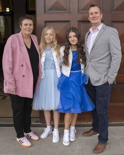 Annie Donnelly with her mam and Hannah Goggin with her dad 