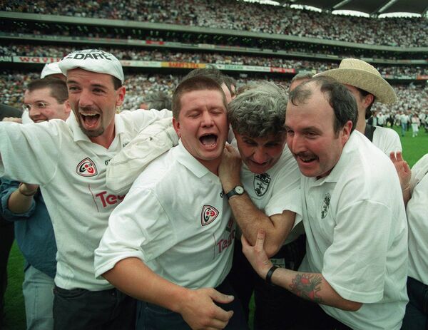 Mick O'Dwyer is mobbed by Kildare fans after the Leinster Final win in 1998 Photo: Inpho/James Meehan