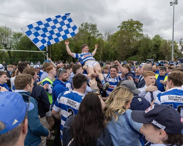 Athy's Jack Henry is lifted by joyous supporters in the post-match celebrations