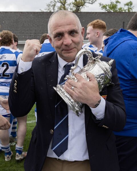 Athy RFC club president Ger Brennan is one happy man as his club finally get their hands on the Towns Cup trophy once again