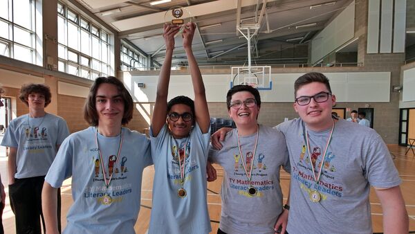 The Champions from St Maccartens with their trophy.