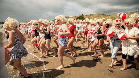 Almost 200 Marilyn Monroe lookalikes take the plunge for charity swim