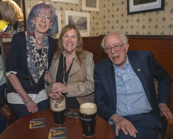 Judith O'Brien with Jane and Bernie Sanders enjoying a pint of Guinness