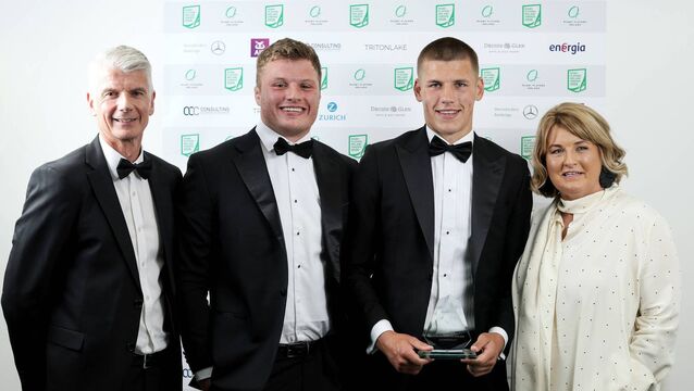 <p>Nevin Spence Men’s XVs Young Player of the Year Award Sam Prendergast with his brother Cian and parents Mark and Ciara after receiving the award Photo: ©INPHO/Laszlo Geczo</p>