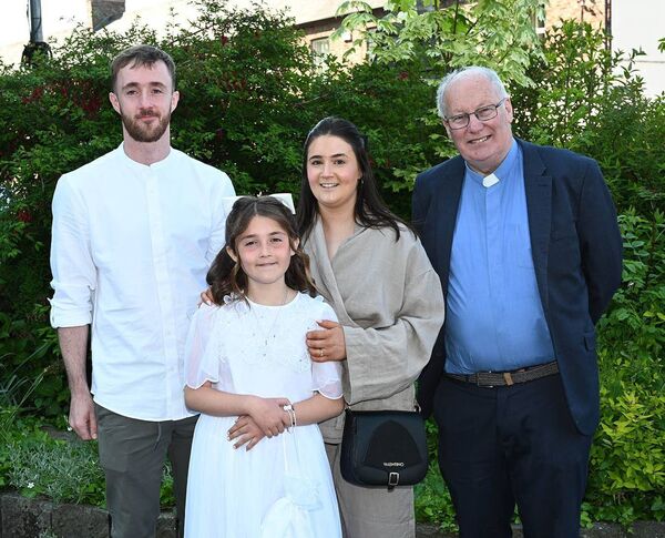 Lily Ryan andfamily with Fr Liam Merrigan PP 