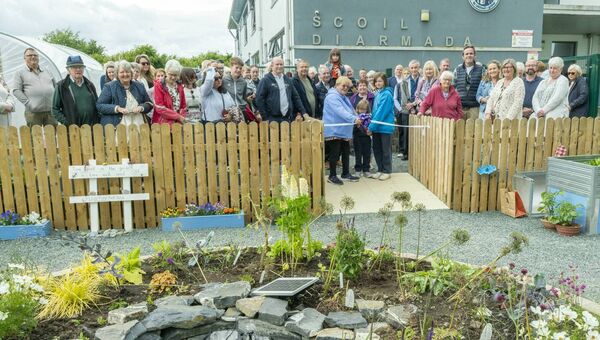 Liz Dooley cuts the ribbon