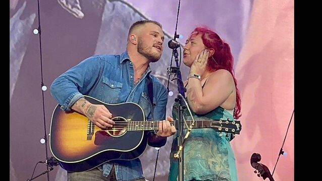 <p>Athy singer Makayla Farrell onstage with Zach Bryan</p>