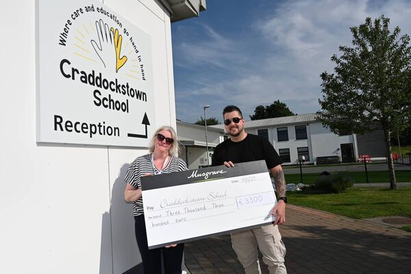 Cheque Presentation for 3300 Euros from Muscgroves and Super Value to Cradockstown School Kate Steed Principal and Kevin Aylward 