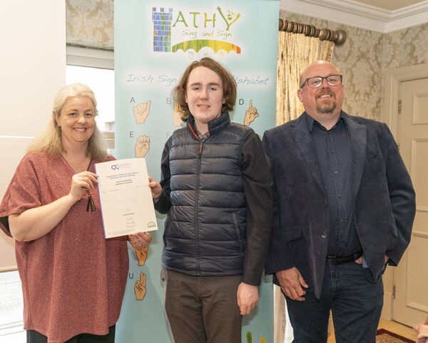 Melissa Howlett presents Caleb Coleman with his cert along side Cllr Mark Leigh