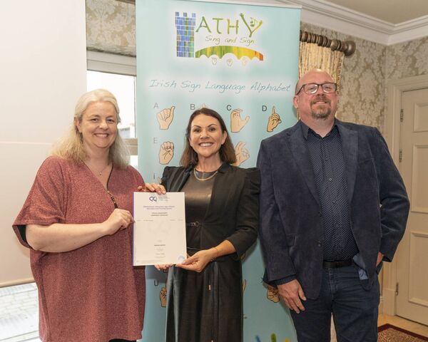 Melissa Howlett presents Miriam Griffen with her cert along side Cllr Mark Leigh