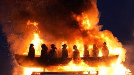 Tyrone bonfire topped with migrant boat effigy is set alight