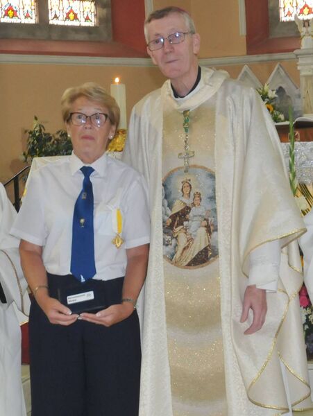 Esther Brady Kildare receives the Benemertini Medal for all her hard and good work with the Carmelite Church in Kildare from Bishop Denis Nulty Photos: Martin Rowe 