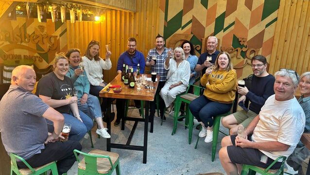 <p>Ballyshannon Action Group celebrate in Dowling's Bar</p>