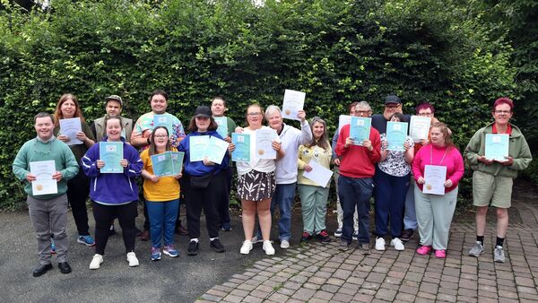 The Camphill service users with their certificates.