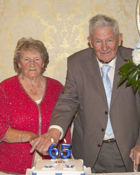 Tom and Shirley Yates cut their anniversary wedding cake Photo: Luke Wynne Tom and Shirley Yates cut their anniversary wedding cake Photo: Luke Wynne