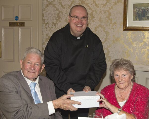 Revd Conor O'Reilly makes a presentation to: Tom and Shirley Yates on the occassion of their 65th wedding anniversary Revd Conor O'Reilly makes a presentation to: Tom and Shirley Yates on the occassion of their 65th wedding anniversary