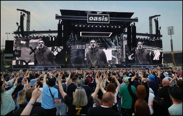 A thunderous cacophony of euphoric screams and rapturous applause met the brothers as they stepped out in front of a frenzied 80,000 people Photo: John Davis A thunderous cacophony of euphoric screams and rapturous applause met the brothers as they stepped out in front of a frenzied 80,000 people Photo: John Davis