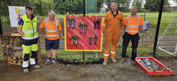 Staff from Murphy International working in the garden Staff from Murphy International working in the garden