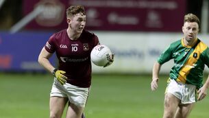 <p>Luke Gill carries the ball forward for Ballykelly during their win over Kill Photo: Sean Brilly</p>