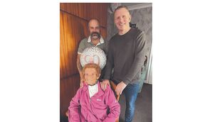 <p>Josie Farrell with her sons Jerry and Eamon</p>
