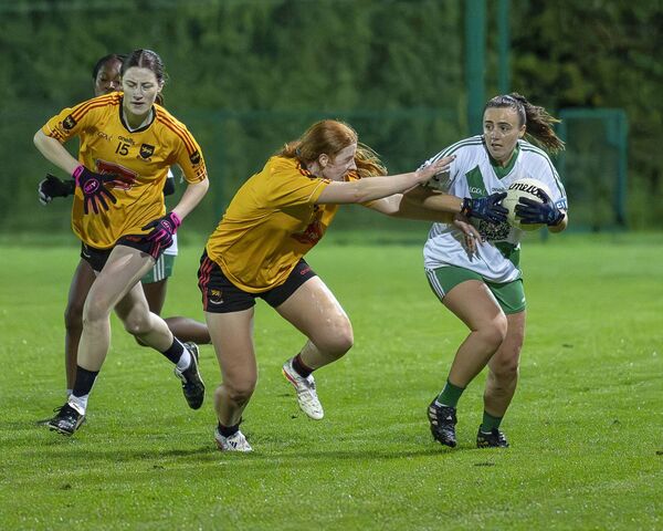 St Laurences' Eimear Glancy puts pressure on Sarsfields' Danielle Clerkin Photo: Aisling Hyland