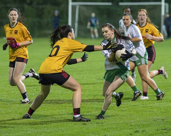 No way through for Sarsfields' Muireann O'Loughlin as Louise Water of St Laurences puts in the tackle Photo: Aisling Hyland