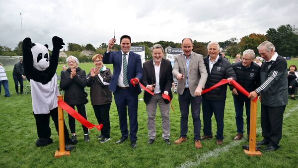 Kilcullen GAA's mascot Raggy and five of the club's Presidents with the three speakers: Betty Lambe, Sue Phelan, Minister Martin Heydon TD, Trevor Schwer, Martin Murphy, Christy Howard, Martin Whyte, and John O'Brien