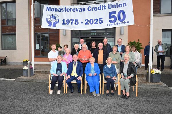 Brendan Jenkins, President of ILCU, Mary Ryan, chairperson of Monasterevin Credit Union, Fr Liam Merrigan PP and founding directors &amp; family members