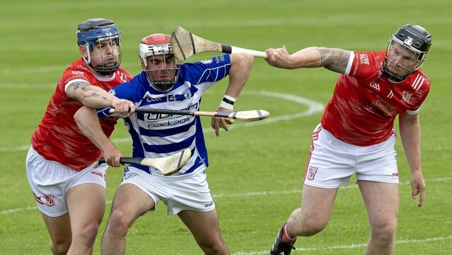 <p>Ferran O'Sullivan (Naas) is tackled by Coill Dubh's Mark Byrne and Declan Flaherty when the teams met in the Cleaning Legends Division 1 final last June Photo: Sean Brilly</p>