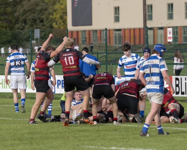 Tullamore players celebrate their winning try after Steven Pyke got the ball down over the line.