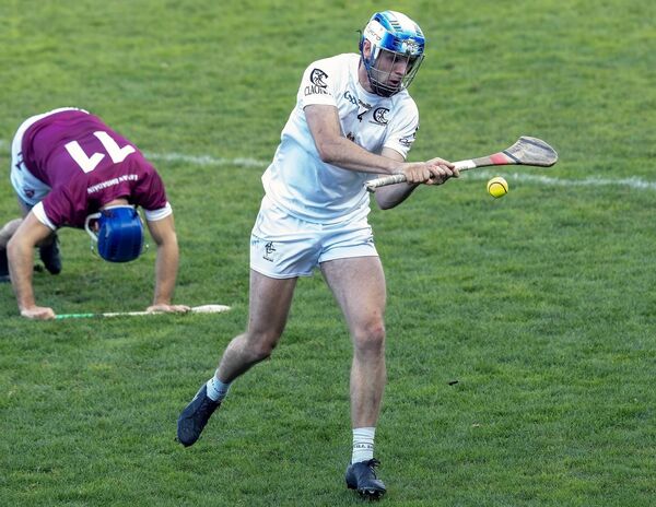 Cian Shanahan clears up the field for Clane