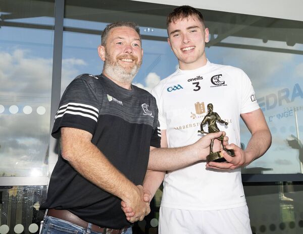 Dave Cahill presents Dan Colbert with the man of the match award