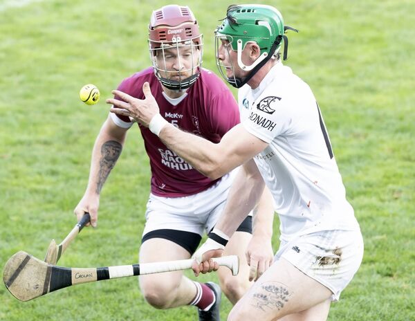 Clane's matchwinner Caolan Smith wins the ball out in front of Leixlip's Conor Higgins 