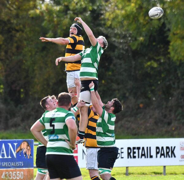 Mark Bennett rises high in the line out for Newbridge Photo: Michael Anderson