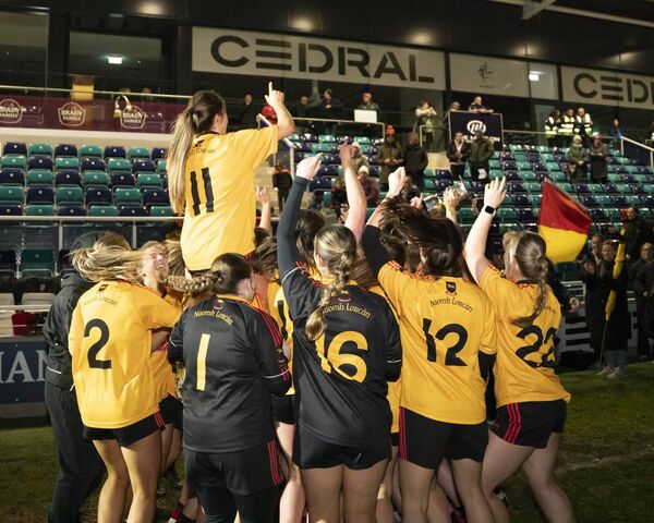 Larries celebrate their Senior Football Championship victory.