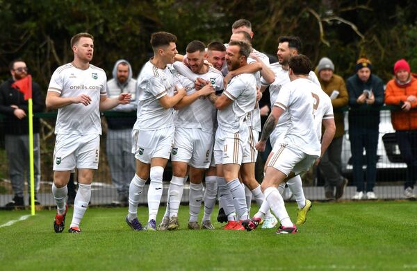Clonmullion players celebrate Nathan Robinson's goal. 