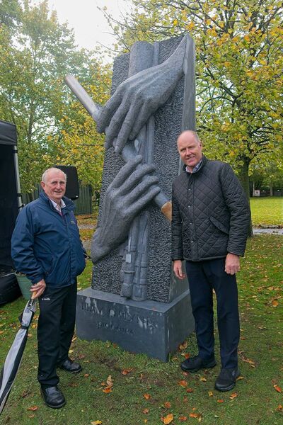 Sean Byrne, Kevin Lawlor, from Kill, pictured with the Commemorative Sculpture for Master Piper Liam O’Flynn in his hometown of Kill
