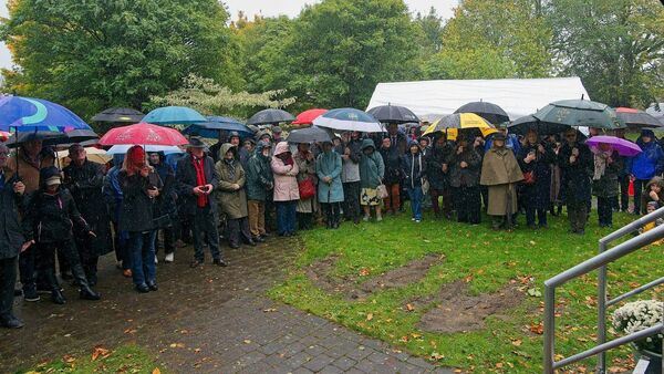 Part of the large crowd braving the elements of Storm Amy at the unveiling ceremony Part of the large crowd braving the elements of Storm Amy at the unveiling ceremony