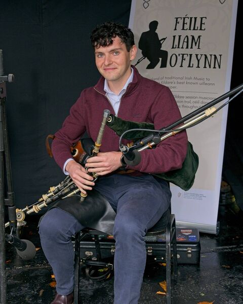 Piper Colm Broderick who was gifted with Liam's uilleann pipes after his death played An Droichead at the unveiling ceremony of the Commemorative Sculpture for Master Piper Liam O’Flynn in his hometown of Kill, Friday