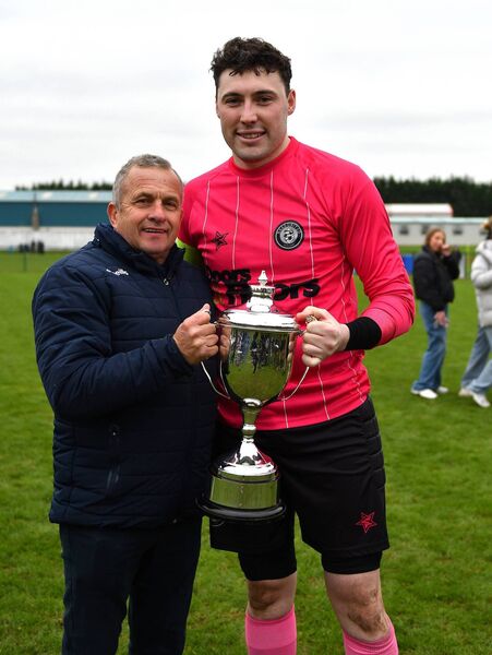 Naas Captain Keith Higgins receives the cup from Robbie Donnelly. Naas Captain Keith Higgins receives the cup from Robbie Donnelly.