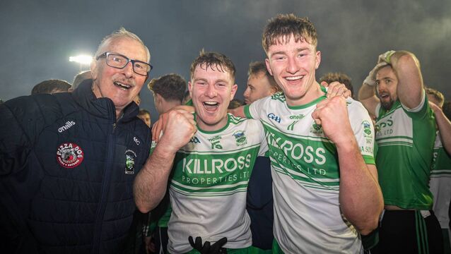 <p>Brothers James and Colm Dalton celebrate with Mick Corley</p>