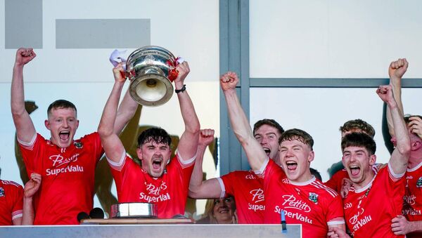 Athy captain David Hyland lifts the Dermot Bourke Cup Photo: ©INPHO/James Lawlor